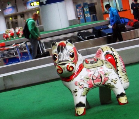 My first photo of China: Horse on a different type of merry-go-round